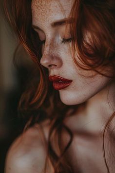 a woman with freckled hair and red lipstick