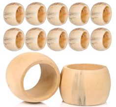 a group of wooden beads and rings on a white background