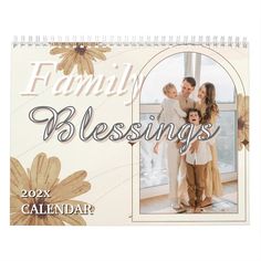 a calendar with the words family blessings on it and two children standing next to each other in front of a window