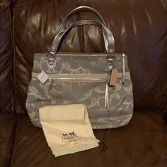 Dove (Gray) And Silver Coach Handbag. Comes With Dust Bag. $198 Original Price Silver Designer Bag With Double Handle, Formal Gray Bag With Silver-tone Hardware, Elegant Gray Bag With Silver-tone Hardware, Silver Bags For Everyday Use, Silver Double Handle Shoulder Bag, Gray Evening Bag With Silver-tone Hardware, Silver Bag With Removable Pouch For Shopping, Designer Silver Travel Bag, Designer Silver Shoulder Bag With Dust Bag