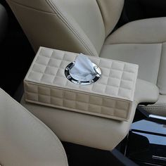 the interior of a car with a tissue dispenser in it's center console