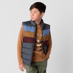 Perfect for layering and providing added warmth without the bulk, this Thereabouts midweight puffer vest for little and big boys is a must-have for cooler days. Made from a plain weave fabric, it features a colorful, block-striped design, a zip-front closure, and two side slip pockets. Style it with a hoodie and jeans. Closure Type: ZipperPockets: 2 Side Slip PocketsWarmth Factor: MidweightOuterwear Length: ShortFiber Content: 100% PolyesterFabric Description: Plain WeaveFilling Content: 100% PolyesterLining Material: PolyesterCare: Machine Wash, Tumble DryCountry of Origin: Imported Blue Husky, Kids Puffer Vest, Puffer Vests, Weave Fabric, Puffer Vest, Plain Weave, Big Boys, Stripes Design, Kids Boys