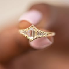 Art Deco inspired engagement ring with one of a kind rose cut diamond and an assemblage of gradient in size baguette cut diamonds from each side. This ring is beaming with light and elegance! MATERIALS: 18k gold | 0.7 carat duchess shape hexagon step cut diamond (OOAK) | assemblage of 10 gradient in size baguette and carre cut diamonds YELLOW 18k gold. Diamond total carat weight: 0.84 Band width: 2 mm Ready to ship in 2-3 weeks. All of our items are MADE TO ORDER, so we need some time to create Dream Wedding Ring, Cute Engagement Rings, Future Engagement Rings, Art Deco Engagement, Dream Engagement, Step Cut, Dream Engagement Rings, Deco Engagement Ring, Pretty Rings