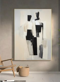 an abstract painting hangs on the wall next to a wooden chair and potted plant