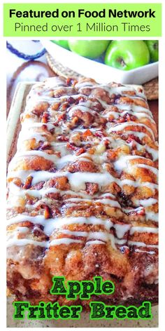 an apple bread with white icing and green apples in the background