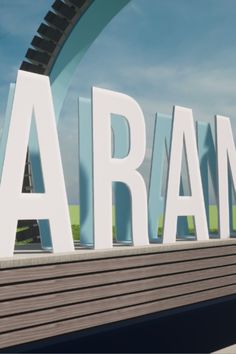 a large sign that says aram on the side of a building