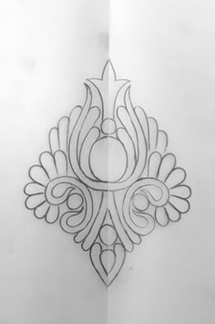 a drawing of an ornate design on paper