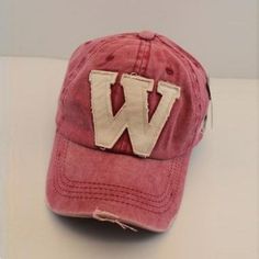 a baseball cap with the letter w on it