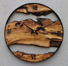 a clock made out of wood with roman numerals