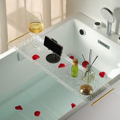 a bathtub with rose petals on the bottom