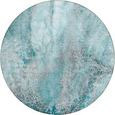 a round rug with blue and grey paint on it