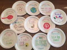 paper plates with different designs on them are arranged in a circle and placed on a table