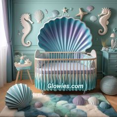 a baby's room decorated in blue and green with seahorses on the wall