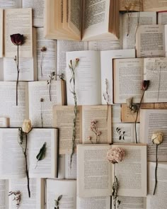 many open books with flowers on them are arranged in the shape of a wallpaper