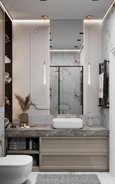 a bathroom with marble counter tops and two sinks