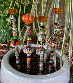 an assortment of colorful glass beads in a planter