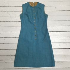 VTG 1960s Blue Teal Scallop Front Button Westbury Fashions Shift Dress Sz 10 S/M. Very cute, unique dress. Condition is Good, some wear to the fabric. Approximate measurements, taken laid flat- Bust: 35 1/2” Waist: 31” Shoulder seam: 4 5/8” Nape to hem: 37 1/2” Shipped with USPS First Class 1950s A-line Dress With Buttons, Blue Vintage Dress With Buttons For Vintage Fashion, Blue Vintage Dress With Buttons, Spring Blue Vintage Dress With Buttons, Blue Vintage Dress With Buttons For Spring, Mod Sleeveless Dresses With Buttons, Vintage Knee-length Buttoned Dresses, Vintage Knee-length Dress With Buttons, Knee-length Buttoned Vintage Fashion Dresses