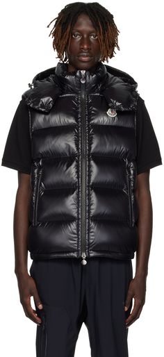 Quilted down-filled nylon laqué vest. · Bungee-style drawstring at detachable hood · Stand collar · Two-way zip closure · Felted logo patch at chest · Zip pockets · Partially elasticized hem · Patch pockets at interior · Full satin lining Supplier color: Black Fill: 90% goose down, 10% feather. Outerwear Vest, Black Vest, Comfy Sweaters, Down Vest, Dark Navy Blue, Detachable Hood, Burgundy Color, Stand Collar, Patch Logo