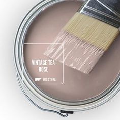 a close up of a paint can with a brush in it and the words sunset drive