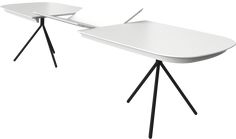 two white tables with black legs on each side