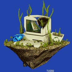 an old computer sitting on top of a floating island with plants growing out of it