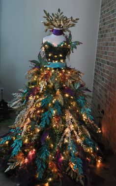 a christmas tree with lights and decorations on it