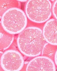 pink grapefruit slices with glitter on them