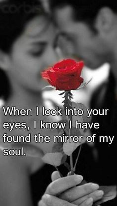 a woman holding a red rose in her hand with the words, when i look into your eyes, i know i have found the mirror of my soul