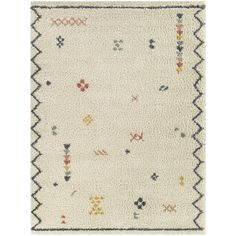 a white rug with multicolored geometric designs on the front and back of it