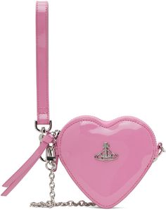 Faux-leather heart-shaped pouch in pink. · Detachable curb chain shoulder strap · Logo hardware at face · Detachable wristlet at side · Accordion panels at sides · Zip closure at four-compartment interior · Cotton twill lining · Logo-engraved silver-tone hardware · H4 x W4.75 x D1 Supplier color: Pink Vivien Westwood, Vivienne Westwood Bags, Wristlet Pouch, Leather Heart, The Vivienne, Fashion Inspiration Design, Silver Engraving, Leather Pouch, Curb Chain