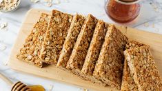 granola bars cut into squares on a cutting board