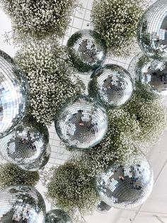 mirrored balls are hanging from the ceiling