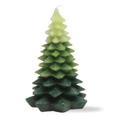 a small green christmas tree candle on a white background