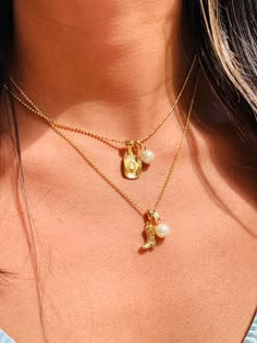 "The ultimate gift necklace for the Coastal or Western cowgirl. 2mm Gold Filled beaded necklace or Cable chain with your choice of a cowgirl boot or hat charm with a pearl. Material: 18 Karat Gold Filled, Hypoallergenic. Tarnish Resistant. Gold-filled does not de-laminate or peel like Gold plated Jewelry nor does it tarnish as readily as silver. Generally speaking, gold filled is better quality and will have a much longer lasting color than plated jewelry. We recommend keeping abrasive chemicals Western Jewelry Gold, Cowboy Hat Necklace, Adjustable Gold Charm Necklace With Pearl Chain, Gold Charm Necklace With Pearl Chain And Adjustable Fit, Adjustable Charm Necklace With Pearl Charm For Everyday, Adjustable Everyday Charm Necklace With Pearl, Adjustable Pearl Charm Pendant Necklace, Dainty Pearl Charm Necklace With Initial Pendant, Western Charm Necklace