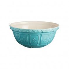 a blue bowl sitting on top of a white table