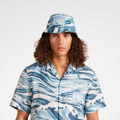 Maison Kitsune and Vilebrequin have teamed up to create a capsule collection of swimwear essentials for your next destination holiday.Bucket HatVilebrequin x Maison Kitsuné LabelSize XS/S: 58cmSize M/L: 60cmBucket HatBucket hat Waves100% Organic Cotton To take care of your favourite Hat, we advise you to follow our suggestions below:Sure, it's tempting, but we have to say no: do not wash your Hat.Do not use oxygenated or chlorine based bleach/ stain removers.Air-dry your Hat and do not use tumbl Blue 5-panel Summer Hats, Blue Flat Brim Bucket Hat For Summer, Blue 5-panel Beach Hats, Destination Holiday, Men Swimwear, Stain Removers, Cotton Bucket Hat, Capsule Collection, Air Dry