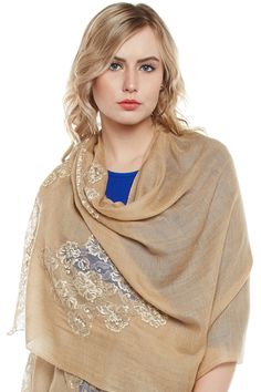 Let your friends, peers, companions and everyone around you know about the glory of your roots with a winter stole handwoven in the regality of Kashmiri Pashmina. The stole features a minimal mocha base tone, which is embellished around the fringes in a contrasting gold French Chantilly lace, making this piece a must buy for the women who know how to dress up in traditions, even in the modern world. Elegant Winter Dupatta Scarf, Elegant Scarf With Traditional Drape For Winter, Elegant Scarves With Traditional Drape For Winter, Elegant Winter Scarves With Traditional Drape, Beige Pashmina Shawl In Traditional Drape, Elegant Beige Pashmina Shawl With Traditional Drape, Elegant Beige Scarves For Festive Season, Elegant Beige Festive Scarves, Brown Pashmina Shawl