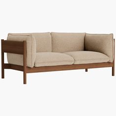 a couch with two pillows on top of it and a wooden frame around the back