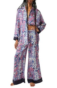 Make bedtime a bit more boho in flowery pajamas that live up to their dreamy designation. 28 1/2" to 31" top length; 28" inseam; 32" leg opening; 14" front rise; 17" back rise (size Medium) Top has spread collar; long sleeves 100% polyester Hand wash, line dry Imported Tie Waist Maxi Dress, Free People Velvet, Floral Pajamas, Free People Intimates, Mesh Skirt, Print Pajamas, Set Free, Menswear Inspired, Wide Legs