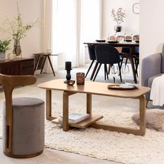 a living room filled with furniture and a table