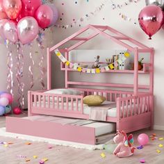 a child's bedroom with pink furniture and balloons