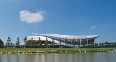 a large building sitting next to a body of water