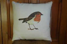 a pillow with a bird painted on it