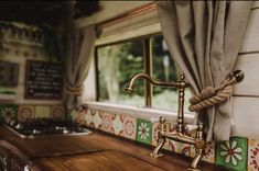 an old fashioned kitchen with wooden counter tops