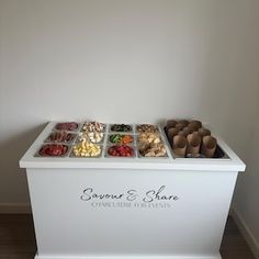 a white box filled with different types of candies