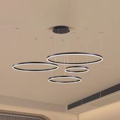 modern circular chandelier suspended from the ceiling