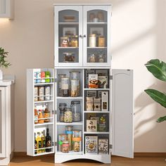 an open cabinet in the middle of a kitchen with lots of food and drinks inside