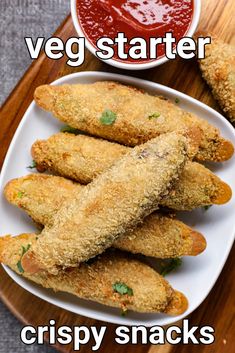 some fried food on a white plate with ketchup