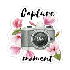 a camera with pink flowers on it and the words capture the moment written in black ink