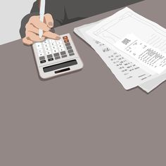 a person using a calculator and pen to check out some papers on a table